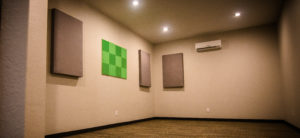 Soundproofed, climate controlled band practice room with acoustic panels for controlling reverberation and flutter echo. Photo Gallery